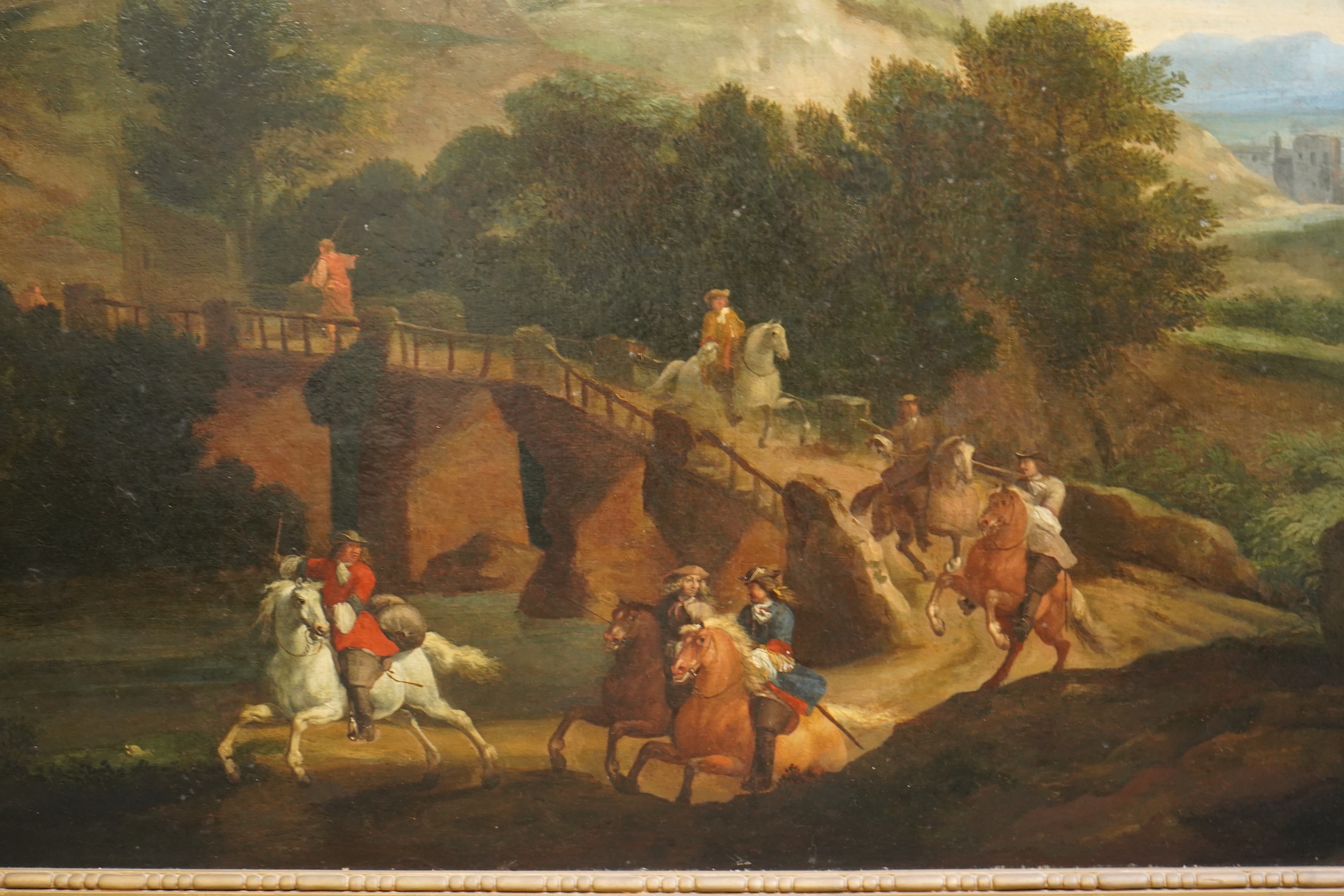 19th century Flemish School , 17th century style Italianate landscape with riders on a lane, oil on canvas, 56 x 129cm